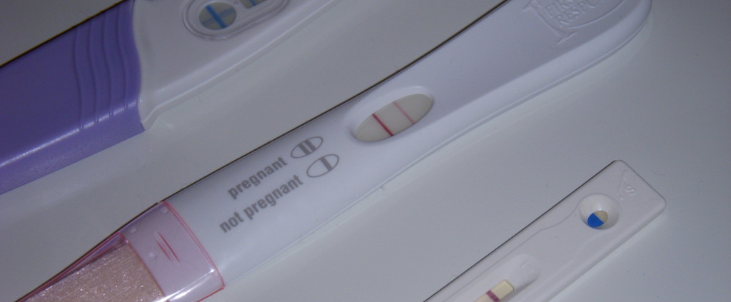 Image shows three pregnancy tests, all with a positive result