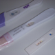 Image shows three pregnancy tests, all with a positive result
