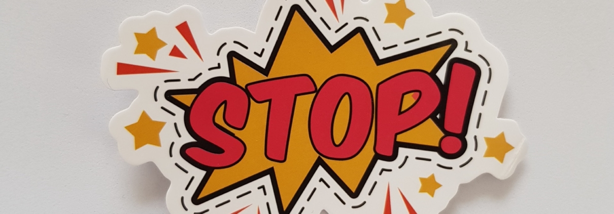 cartoon depiction of an explosion with the word STOP! in the middle