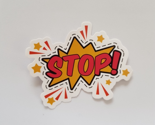 cartoon depiction of an explosion with the word STOP! in the middle