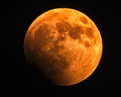 orange-red coloured full moon