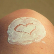 skin with a white cream on it and a love heart shape drawn in the cream