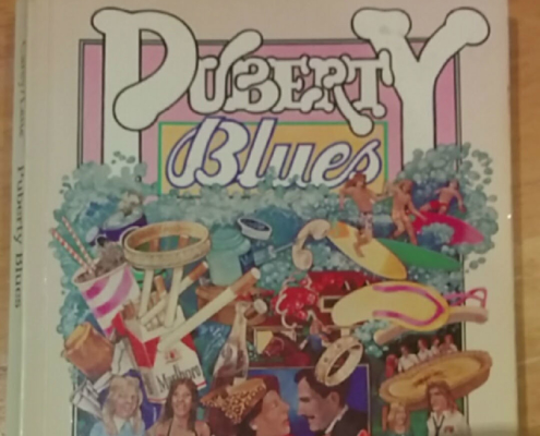 Top half of book cover with title "Puberty Blues"